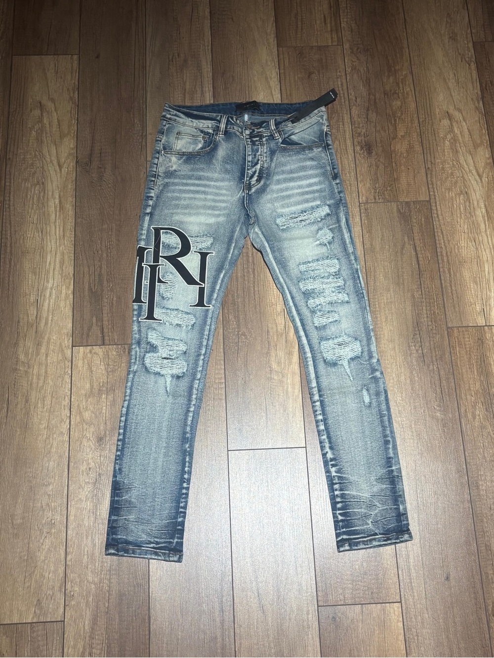 Amiri Light Blue Ripped Skinny Jeans with Black Logo Brand New Waist Size 32